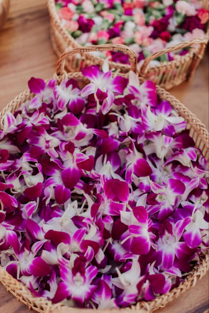 a basket of flowers at a Maui wedding lei-making station