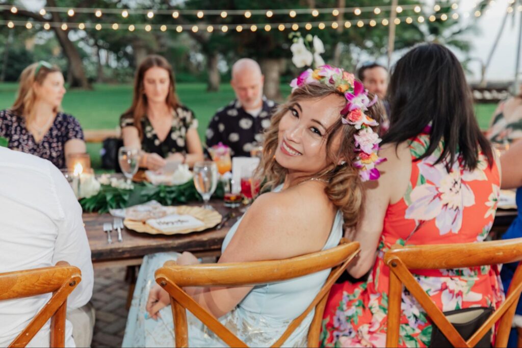 people sitting at a dinner table at a Maui wedding