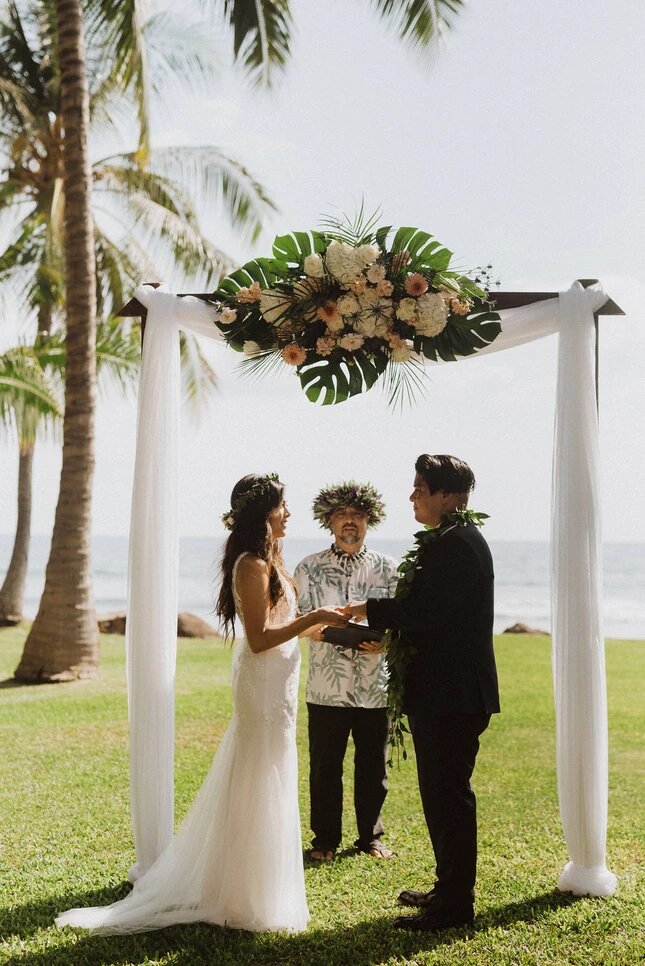 couple exchanges vows outdoors in Maui Hawaii
