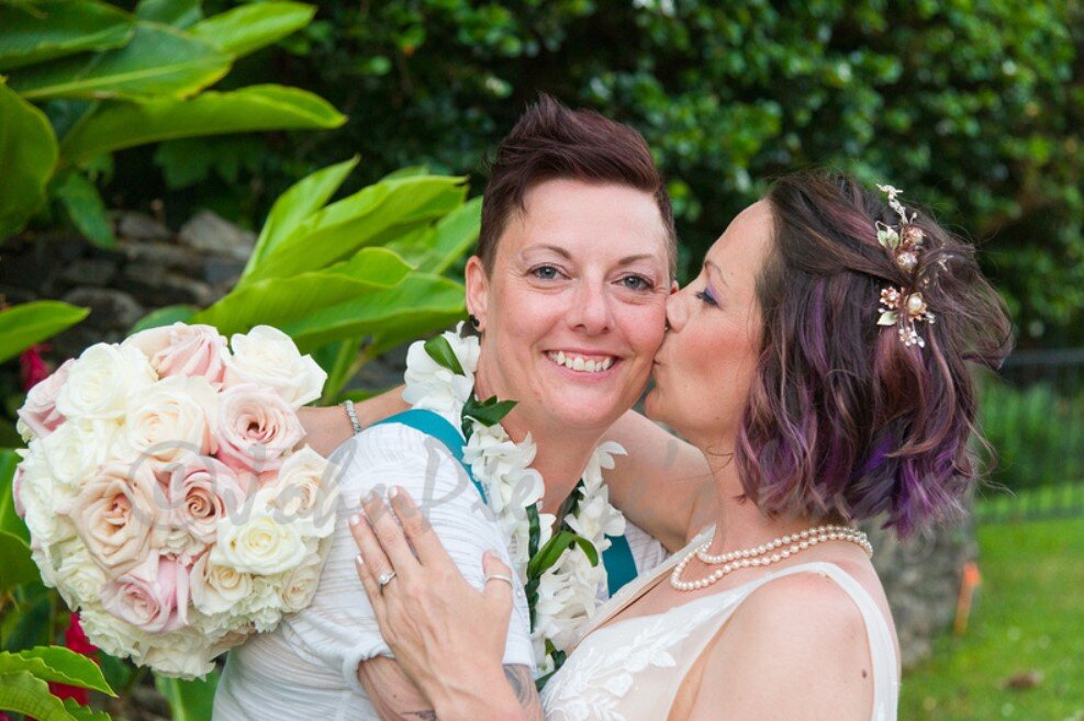 newlyweds kiss at their Maui wedding