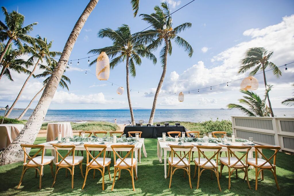 outdoor wedding reception under palm trees at Sugar Beach Events in Maui