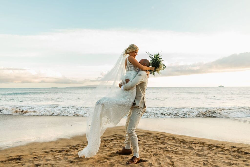 wedding couple dance together on Maui beach